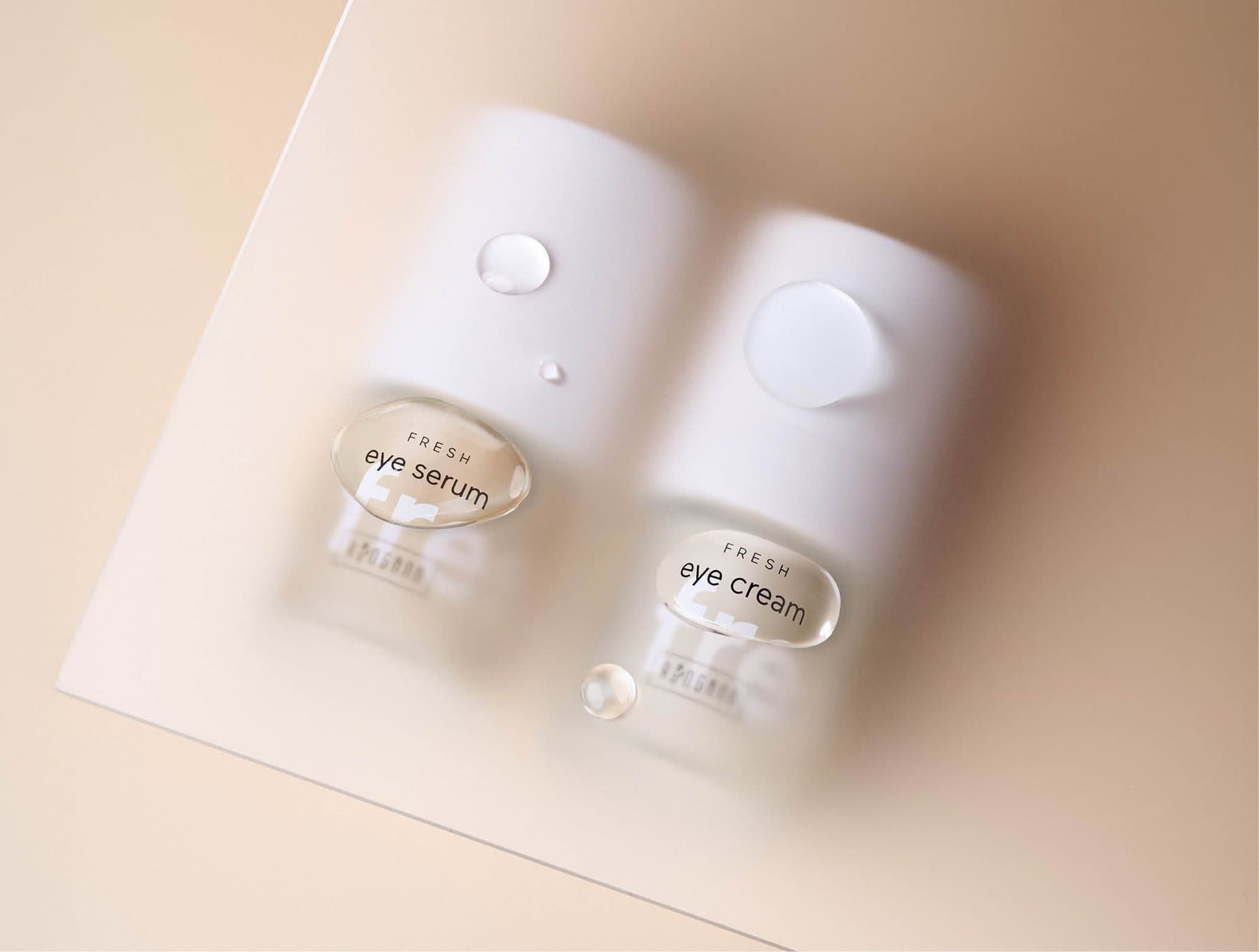 Ringana FRESH eye serum and eye cream seen through water droplets